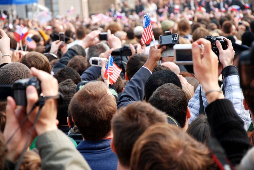 Crowd of people taking pictures